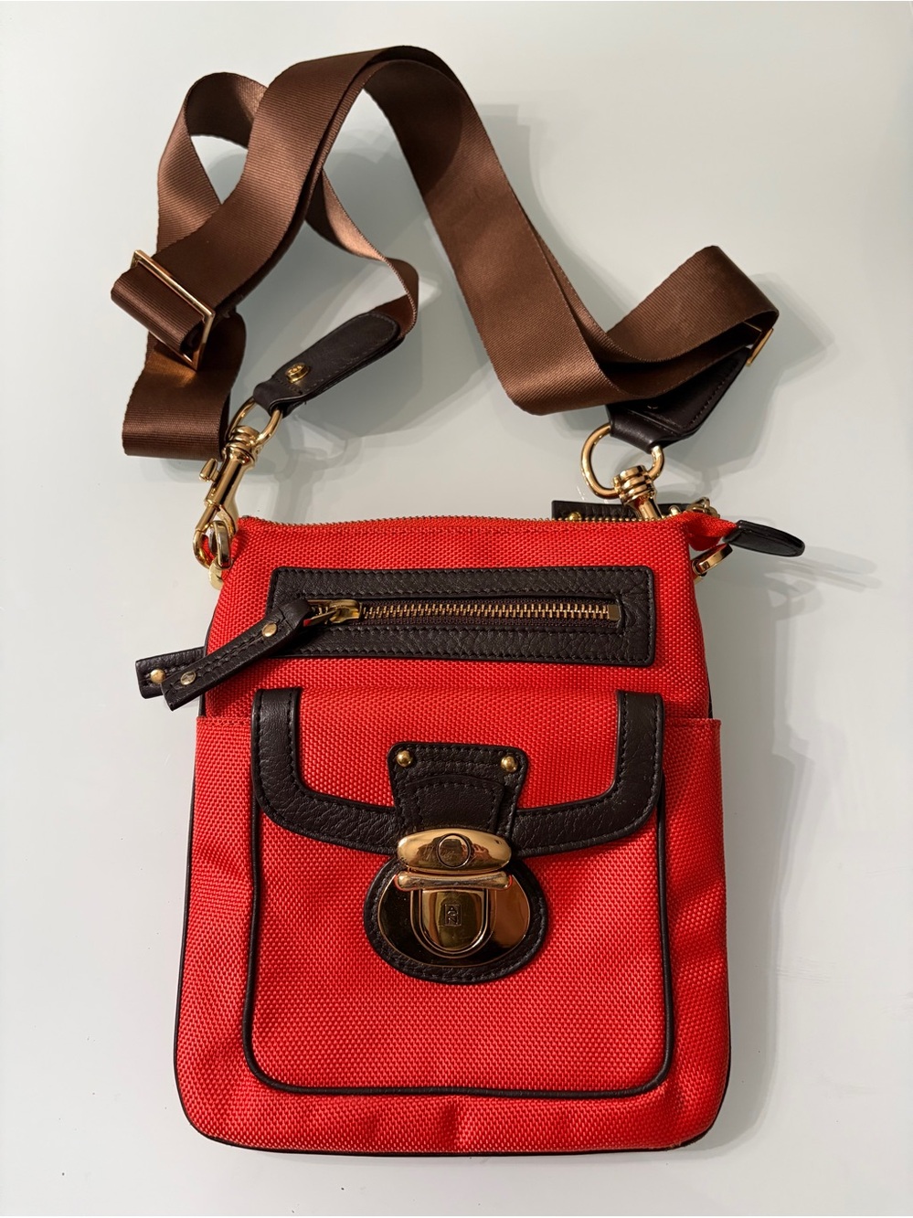 Red Crossbody Bag with Brown Trim and Gold-Tone Hardware